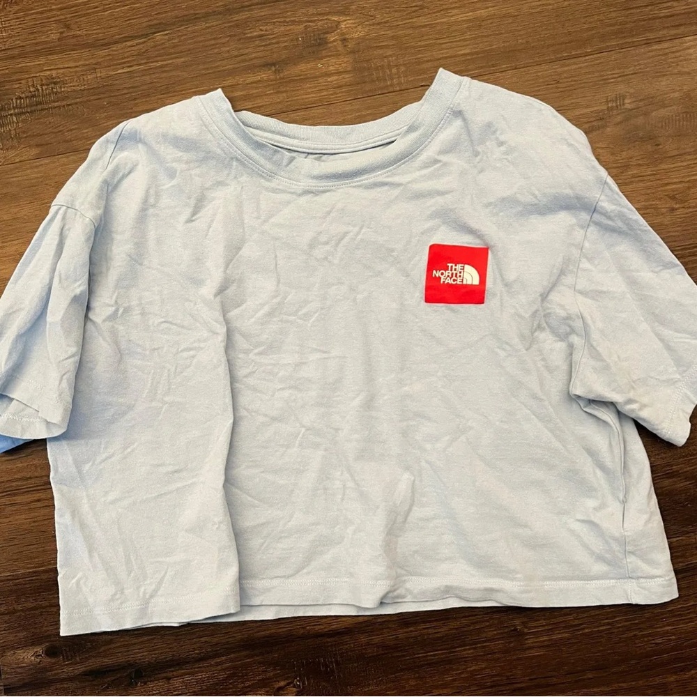 The North Face Sky Blue Cropped Tee with Red Logo